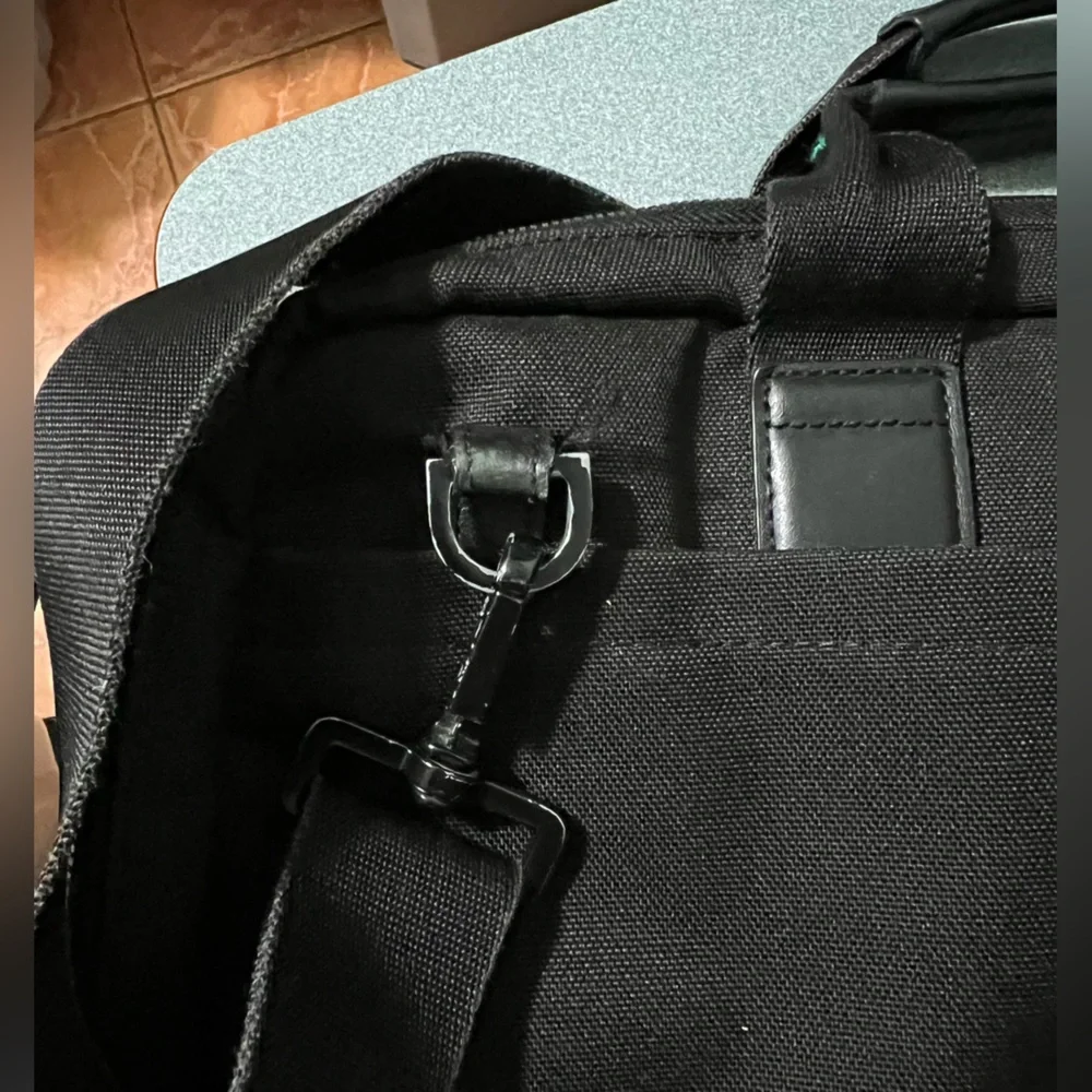 KNOMO Black Unisex Laptop Briefcase Messenger Bag with many compartments.